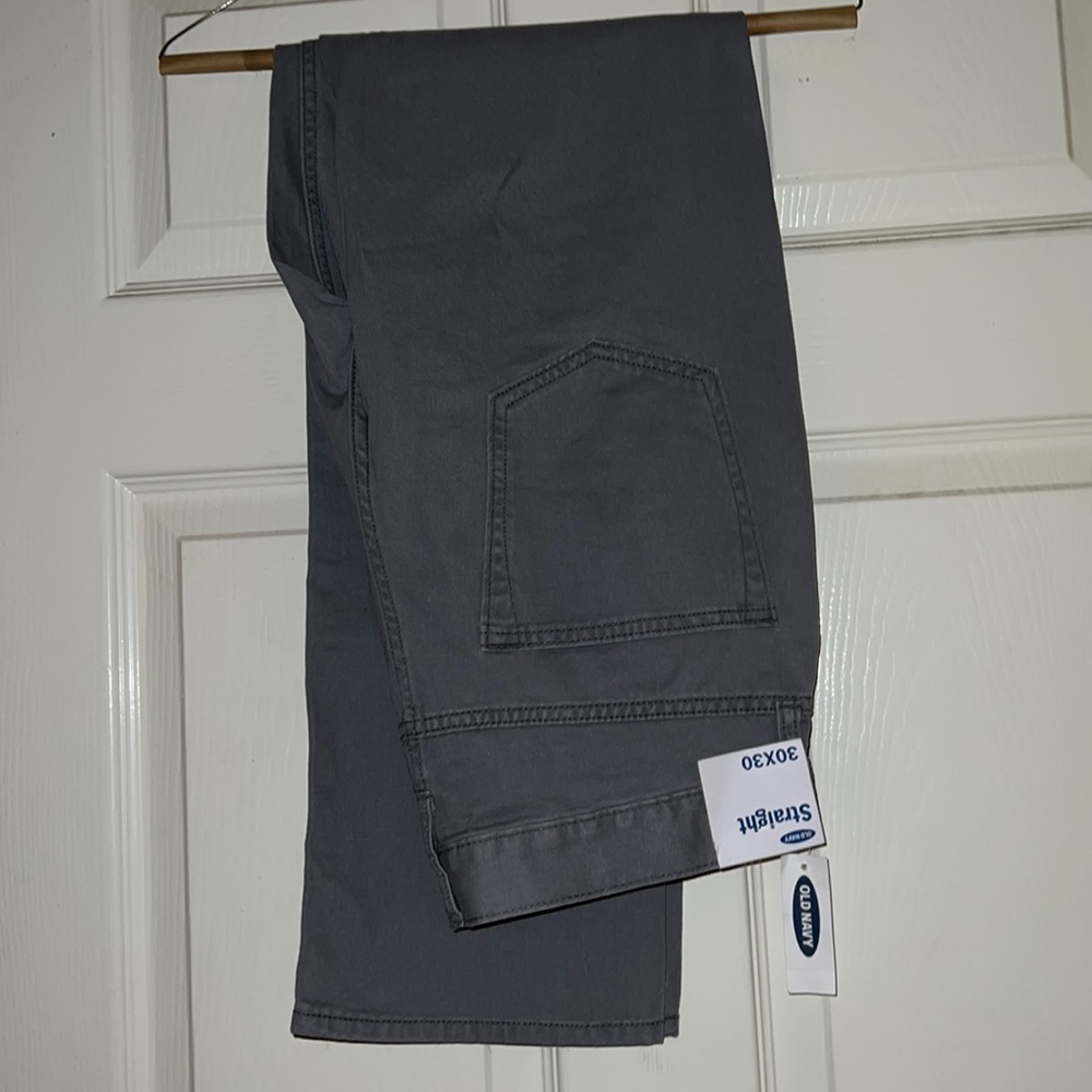 Grey straight legged pants.